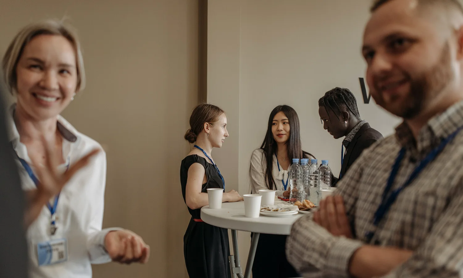 Professionals networking and speaking during a business gathering