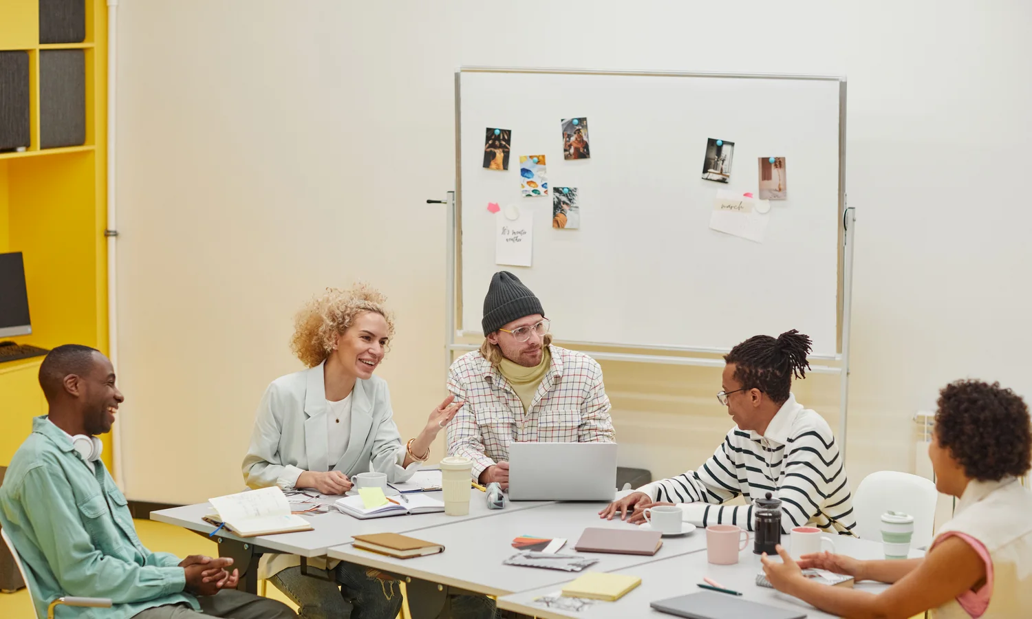 A diverse professional team sharing ideas during a workshop